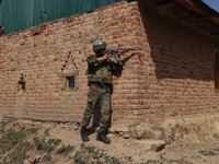 Indian army soldiers take position during CASO Cordon And Search Operation drill in South Kashmir's Kulgam District, Jammu and Kashmir, Indi...