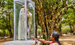 Tamil Catholic devotee offers prayers at a small shrine dedicated to a Catholic saint in M...