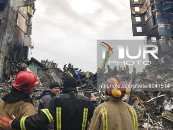 Ukrainian Rescuers worked to clear the rubble after the collapse of buildings destroyed by russian army in Borodyanka city near Kyiv, Ukrain...