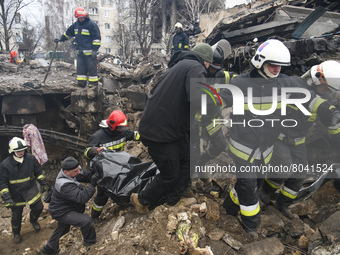 Ukrainian Rescuers remove the body of a resident  of apartments blocks destroyed by russian army in Borodyanka city near Kyiv, Ukraine, 09 A...