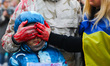 Ukrainian citizens and supporters attend a silent protest at the Main Square against the m...