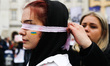 Ukrainian citizens and supporters attend a silent protest at the Main Square against the m...
