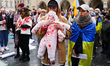 Ukrainian citizens and supporters attend a silent protest at the Main Square against the m...