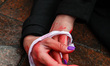Ukrainian citizens and supporters lay on the ground playing dead while attending a silent...