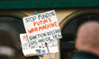 a sign of "stop funding putin machine" is seen during the antiwar protest in Bonn, Germany...