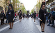 Women dressed in black and carrying candles during the Palm Sunday in Granada, Spain, on A...