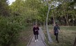 An Iranian young man and a young woman walk in an urban park in downtown Tehran on April 1...