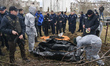 French forensics investigators, who arrived to Ukraine for the investigation of war crimes...