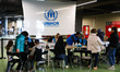 Refugees from Ukraine who fled to Poland after Russian attack are seen at a cash enrolment...