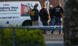 Police search a U-Haul truck in New York City suspected to be driven by the gunman that op...