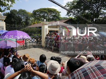 Relatives wait for the release of prisoners from Insein Prison in Yangon, Myanmar on April 17, 2022. (