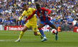  Crystal Palace's Wilfried Zaha holds of Chelsea's Mason Mountduring FA Cup Semi-Final bet...