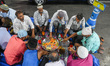 People are seen gathered together to break their fast  at iftar time during the holy month...