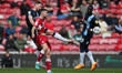 Tom Lees of Huddersfield Town contests a header with Middlesbrough's Andraz  Sporar   duri...