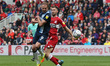 Jordan Rhodes of Huddersfield Town battles for possession with Andraz  Sporar during the S...