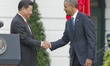 United States President Barack Obama and President XI Jinping of China shake hands after t...