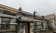 ZAPORIZHZHIA, UKRAINE - APRIL 16, 2022 - Labourers work to repair a 70-year-old building s...