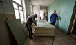 ZAPORIZHZHIA, UKRAINE - APRIL 16, 2022 - Labourers work to repair a 70-year-old building s...