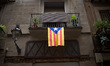 A estelada (catalan independentist flag) hangs from a balcony in Barcelona on 27 Sept. 201...