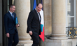 Prime Minister Jean Castex, followed by Deputy Finance Minister Olivier Dussopt, leaves th...