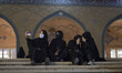 A group of Iranian young women wearing protective face masks take a selfie in the Imam Kho...