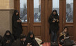 Iranian veiled women pray in the Imam Khomeini Grand mosque in downtown Tehran during the...