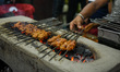 A man is seen barbecuing various meat at a restaurant ahead of Iftar time in Kolkata , Ind...