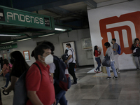 Passers-by inside the Constitutción de 1917 metro station in Mexico City, where the AstraZeneca biological is being applied to people who ha...