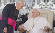 Pope Francis is flanked by Monsignor Leonardo Sapienza as arrives to start his weekly gene...