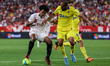 Jules Kounde of Sevilla CF in action with Fali of Cadiz CF during the La Liga Santader mat...