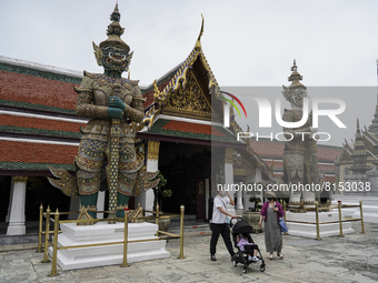 Foreign tourists wearing face masks visit the Temple of the Emerald Buddha in Bangkok, Thailand, 01 May 2022. Thailand allowing vaccinated t...