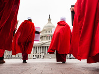 Members of Handmaids Army DC walk silently from theSupreme Court to the Capitol during a protest against the Court’s leaked preliminary deci...