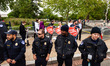 Capitol Police officers stand on front of pro-life activists during a protest against the...