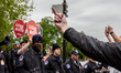 Pro-choice demonstrators send a clear message to pro-life activists disrupting their rally...