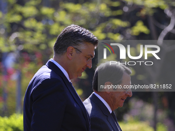Cyprus' president Nicos Anastasiades, right, walks with Croatian Prime Minister Andrej Plenkovic before their meeting at the presidential pa...
