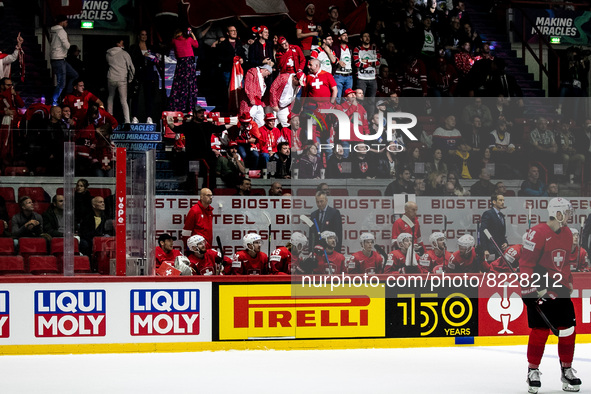 Team swiss bench with spectators in the back 
Team Swiss 
Team Italy 
©IIHF2022  during the Ice Hockey World Championship - Switzland vs... by Andrea Re/LiveMedia/NurPhoto