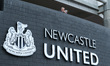 A general view as a fan reads a programme before the Premier League match between Newcastl...