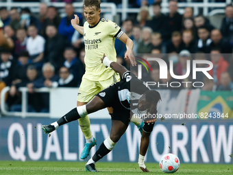 Allan Saint-Maximin of Newcastle United and Martin Odegaard of Arsenal in action during the Premier League match between Newcastle United an...
