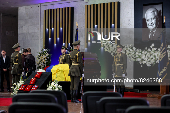 People lay flowers near the coffin with the body of Leonid Kravchuk in Kyiv, Ukraine, May 17, 2022. Dozens of politicians, artists, scientis...