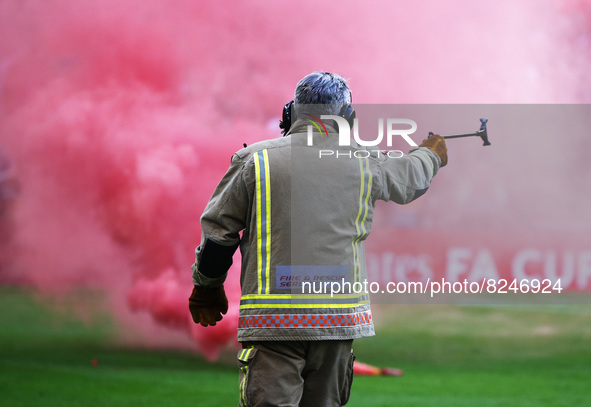 Fireman going clear Flares after  FA Cup Final between Chelsea and Liverpool at Wembley Stadium , London, UK 14th May , 2022
 