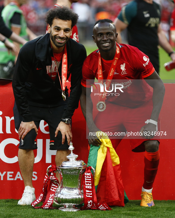 L-R Liverpool's Mohamed Salah and Liverpool's Sadio Mane with the FA Cup after their sides 6-5 penalty shoot-out after a 0-0 draw in normal...