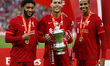 Joe Gomez, Virgil Van Dijk and Joel Matip of Liverpool with the Cup after their sides 6-5...