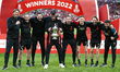 Liverpool manager Jurgen Klopp (MIDDLE) holds the FA Cup with his back Staff after their s...