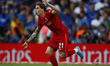 Liverpool's Kostas Tsimikas celebrates after scoring the goal in the penalty shoot out dur...