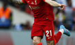 Liverpool's Kostas Tsimikas celebrates after scoring the goal in the penalty shoot out dur...