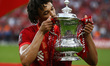 Liverpool's Trent Alexander-Amold kisses the FA Cup after their sides 6-5 penalty shoot-ou...