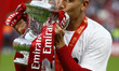 Liverpool's Roberto Firmino kisses the FA Cup after their sides 6-5 penalty shoot-out afte...
