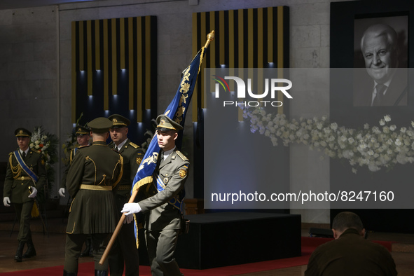 An honor Guardian carries the standard of the President of Ukraine during the funeral ceremony of Ukrainian first president Leonid Kravchuk...