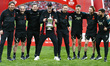 Liverpool manager Jurgen Klopp (MIDDLE) holds the FA Cup with his back Staff after their s...