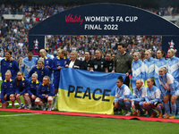 Players of both teams and match officials posing with Ukrainian flag before theWomen's FA Cup Final between Chelsea Women and Manchester Cit...
